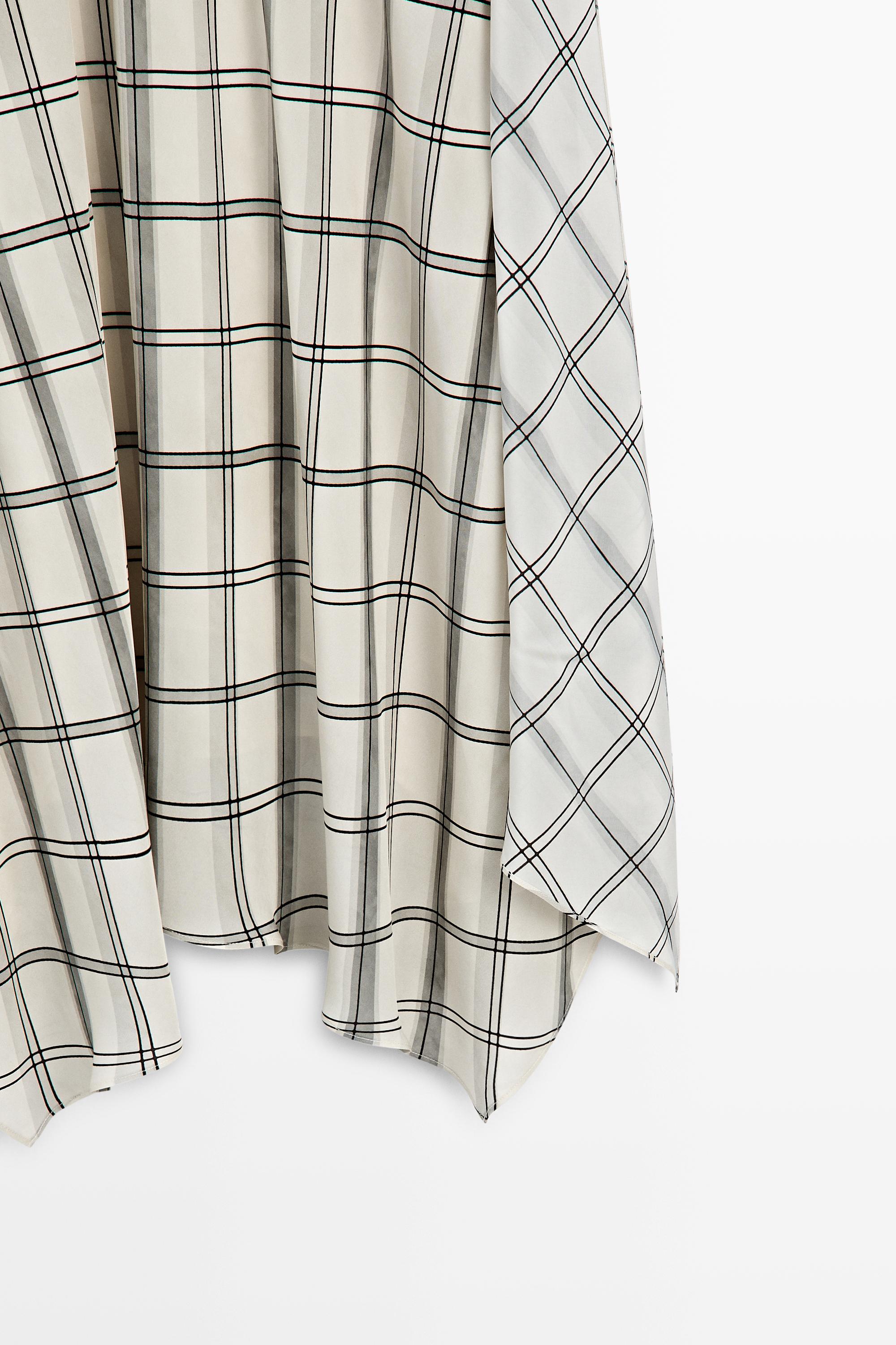 Jupe midi asymétrique à détail carreaux